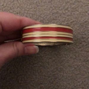 2 gold colored bracelets/one has some color